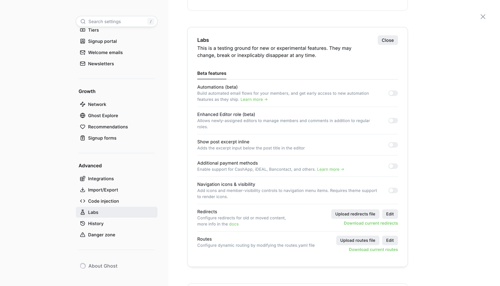 Ghost Admin Labs settings with the Routes controls for uploading a routes file and downloading the current one